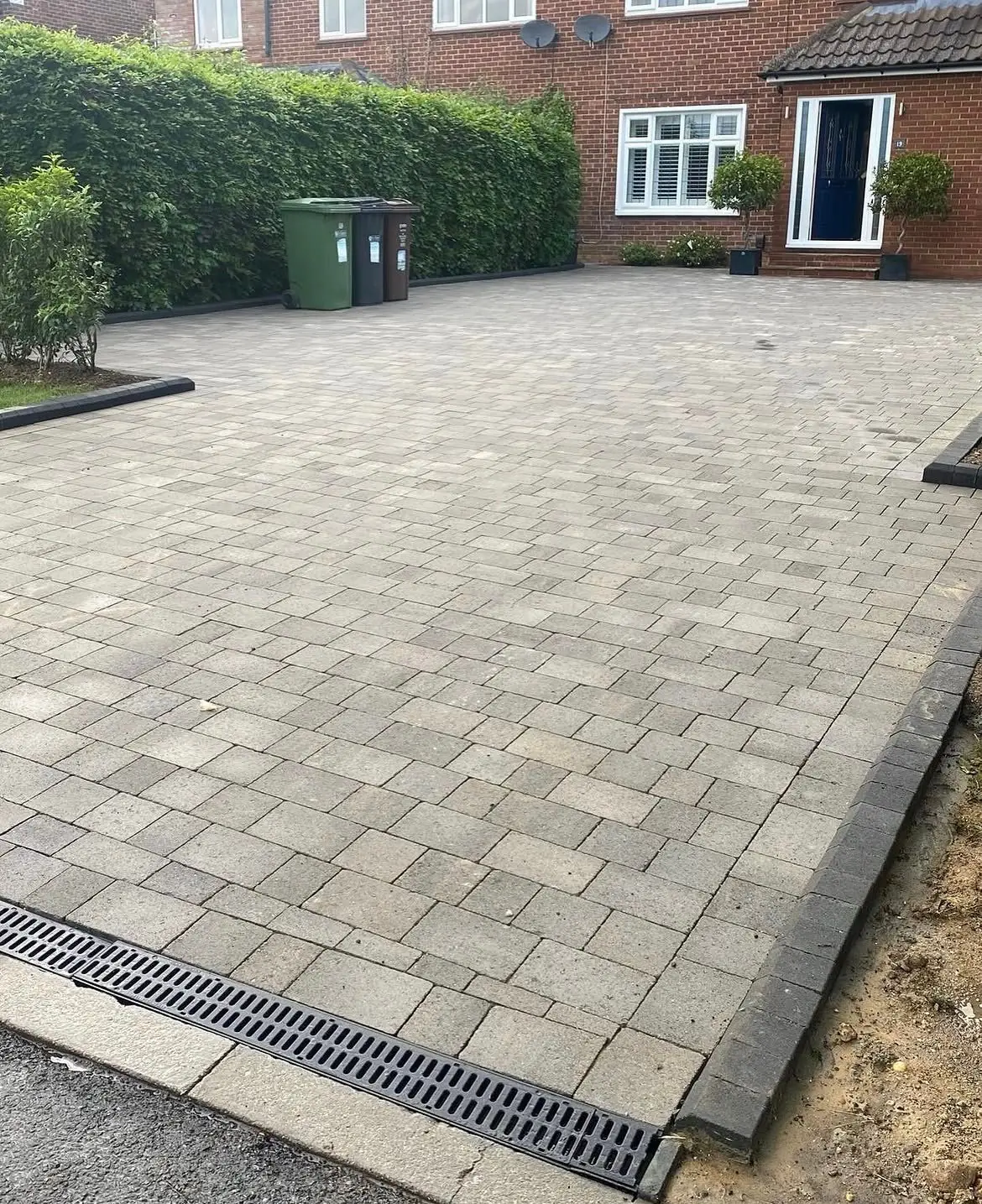 Patio driveway installation with sandstone flags by GX Tree Care